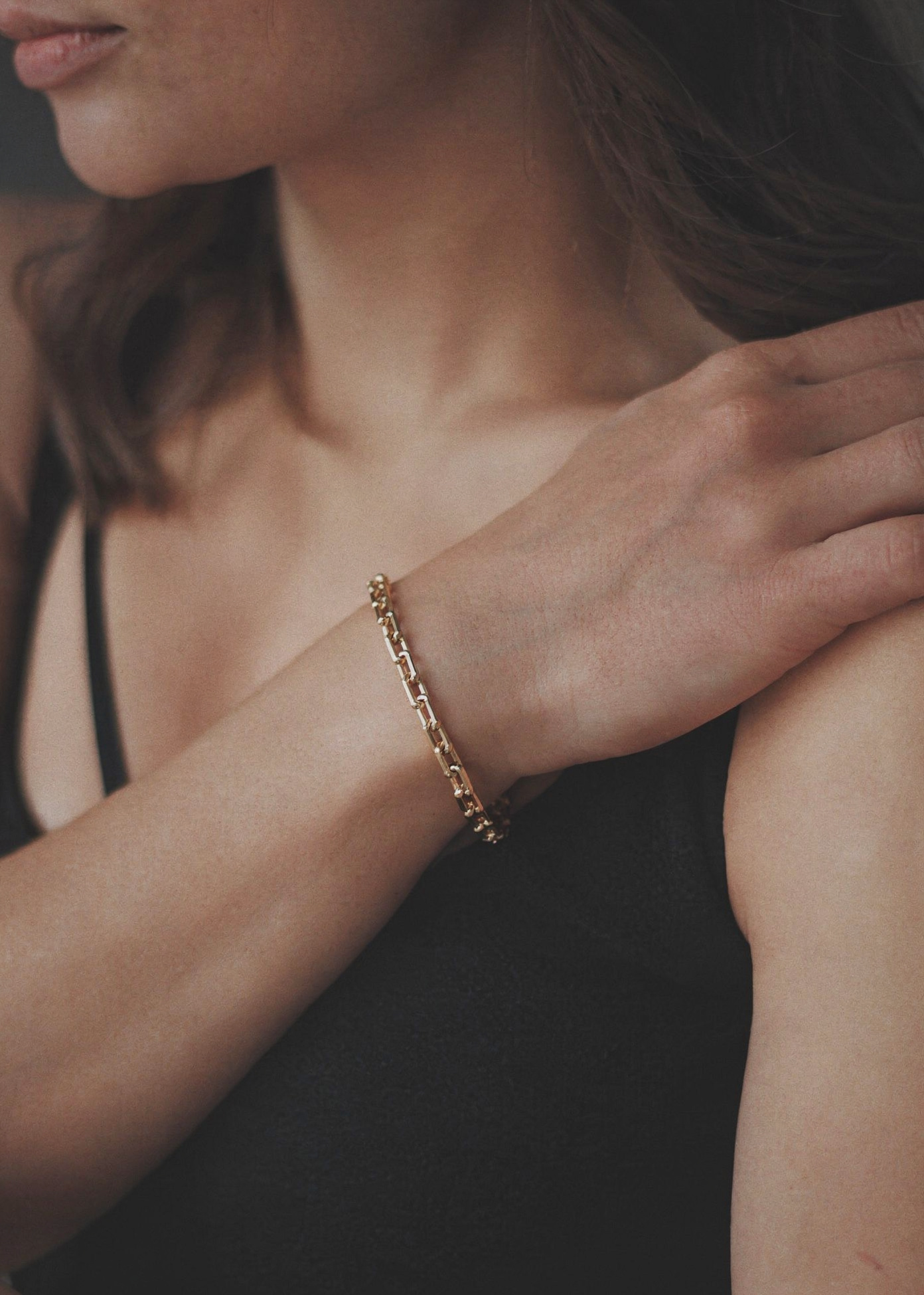 gold link chain bracelet on wrist modern jewellery