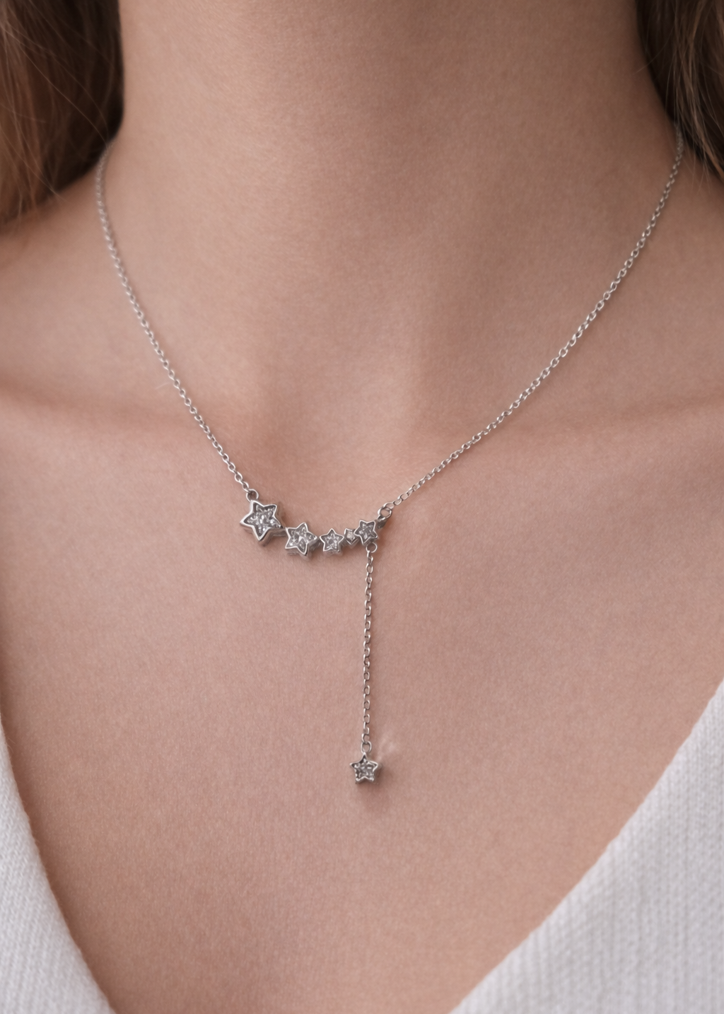 silver star drop necklace with crystal stars and delicate chain detail