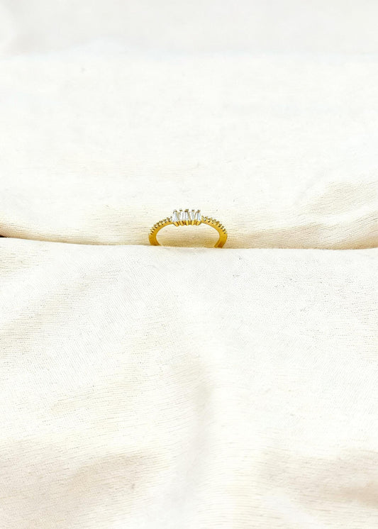Gold adjustable baguette diamond cluster ring on finger