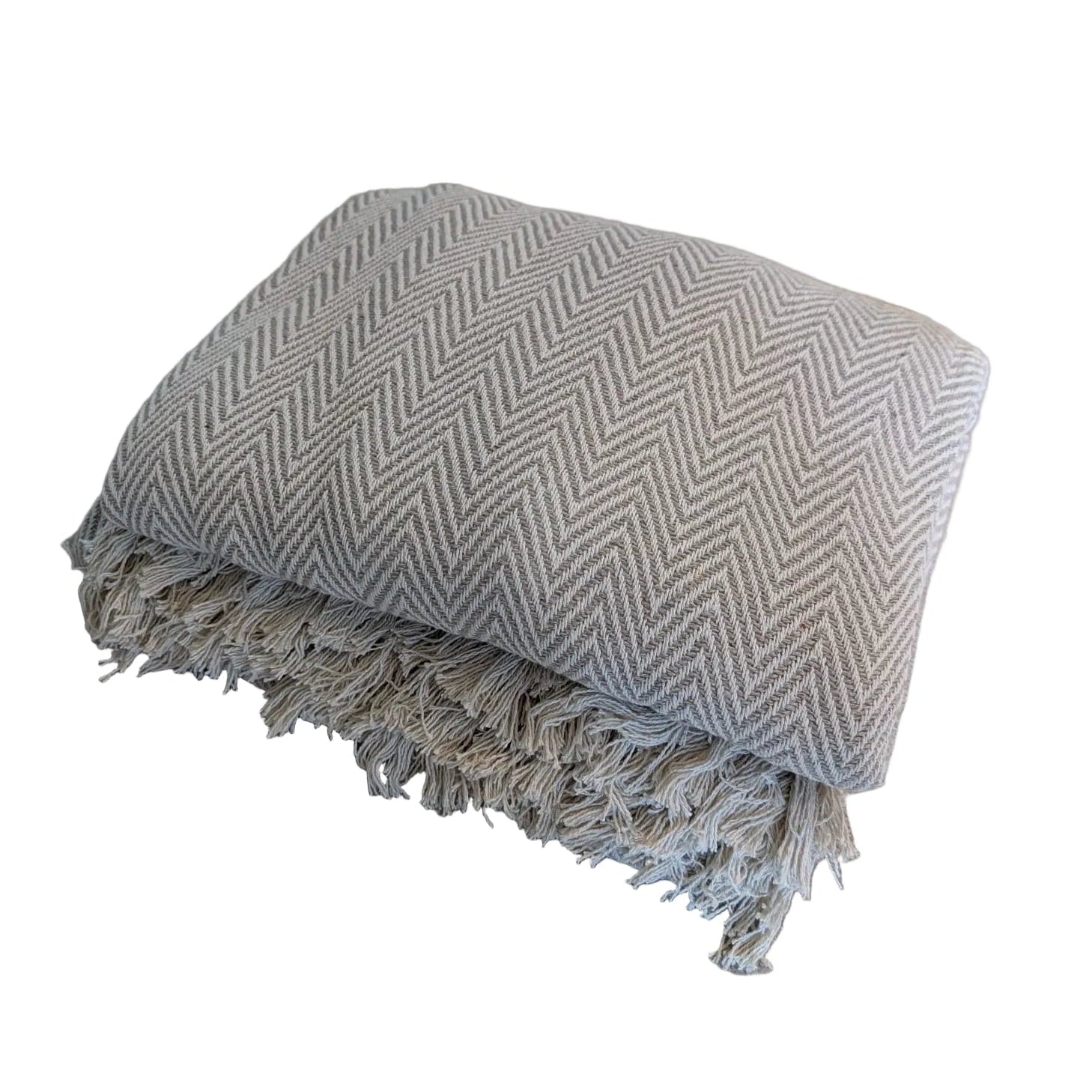 Large beige woven wool throw showing herringbone pattern texture