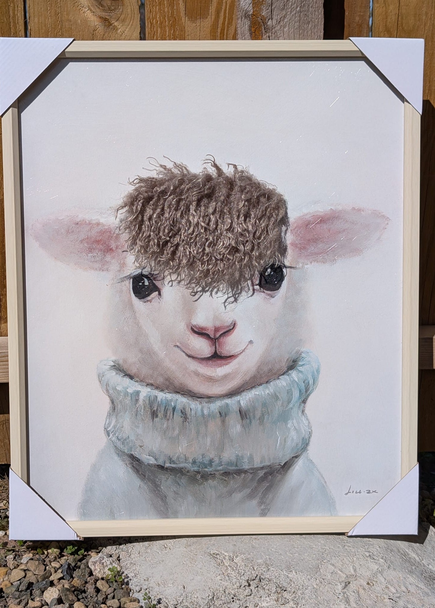 Framed lamb portrait with touchable wool hair detail wearing jumper on neutral background