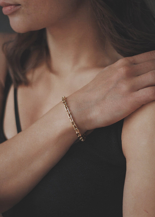 gold link chain bracelet on wrist modern jewellery