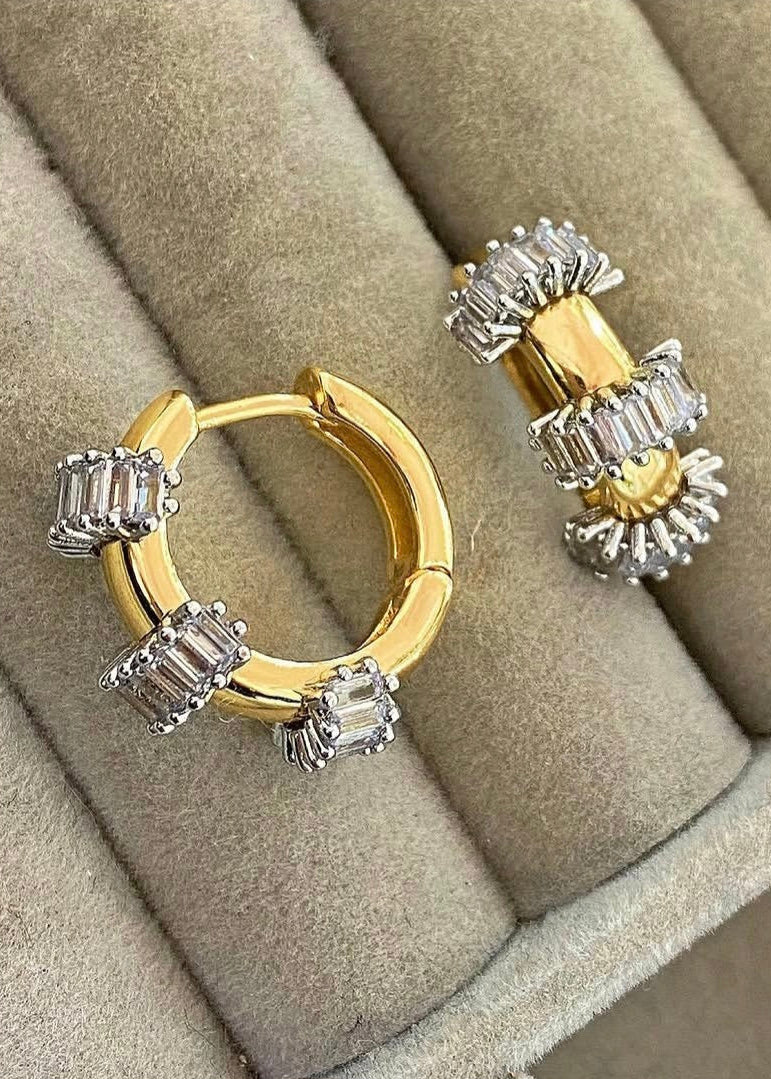 Gold plated hoop earrings with baguette zircon stones close-up