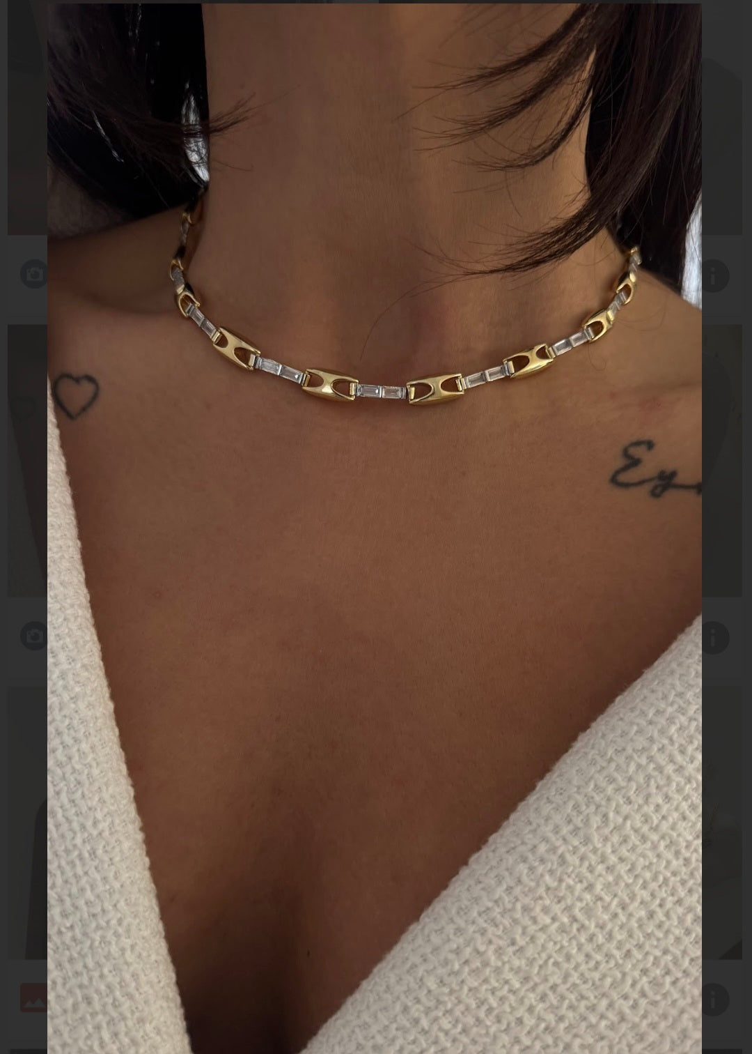 Gold and silver zircon chain link choker necklace on display