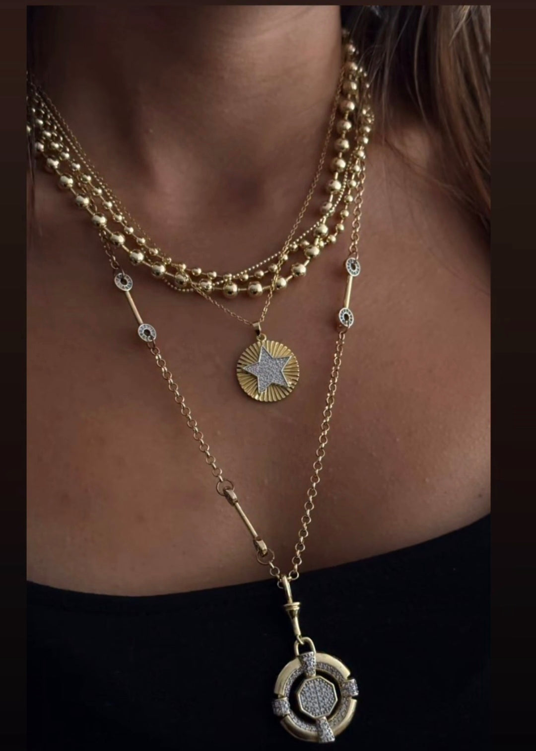 Gold layered star medallion necklace with zircon stones on chain
