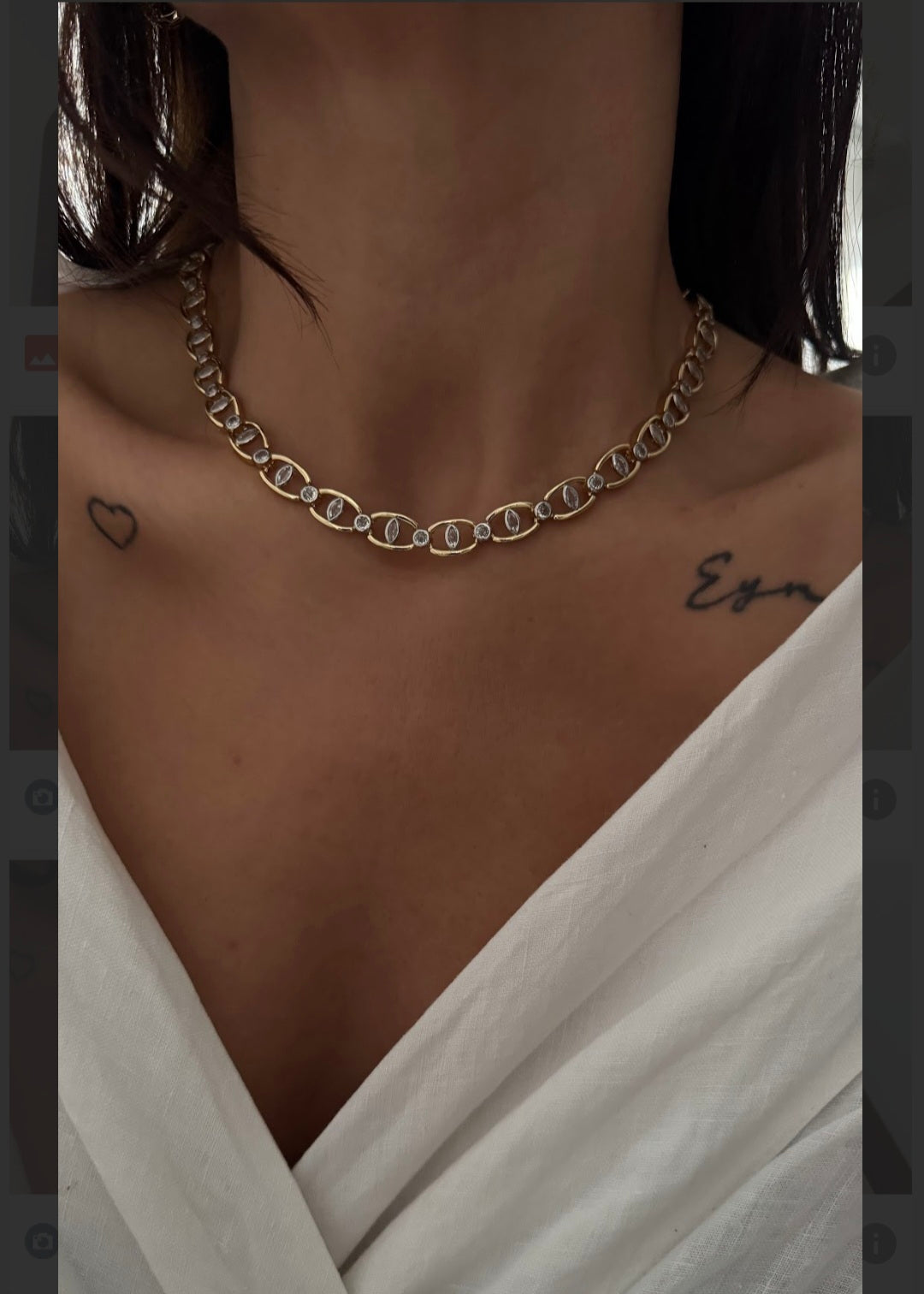 Gold zircon oval link choker necklace worn on neckline