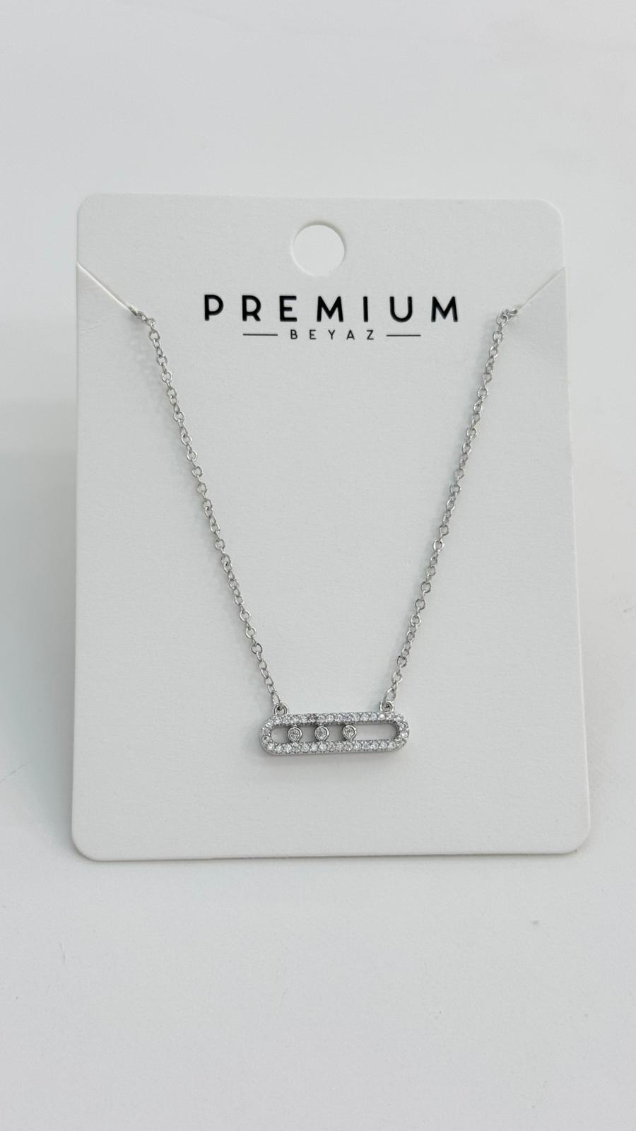 Necklace on a 'Premium Beyaz' branded card against a white background
