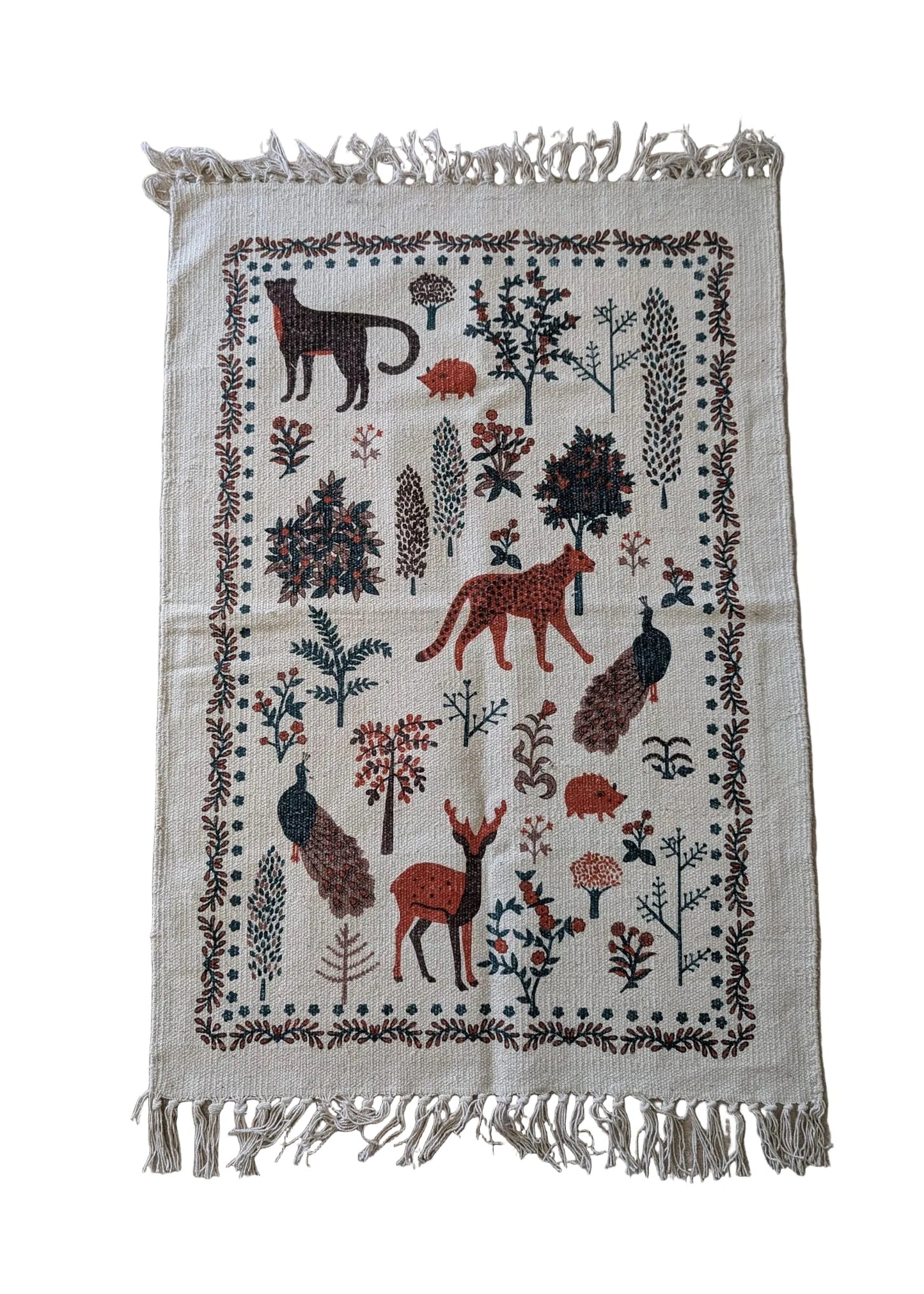 Close-up of cotton rug showing animals and botanical design