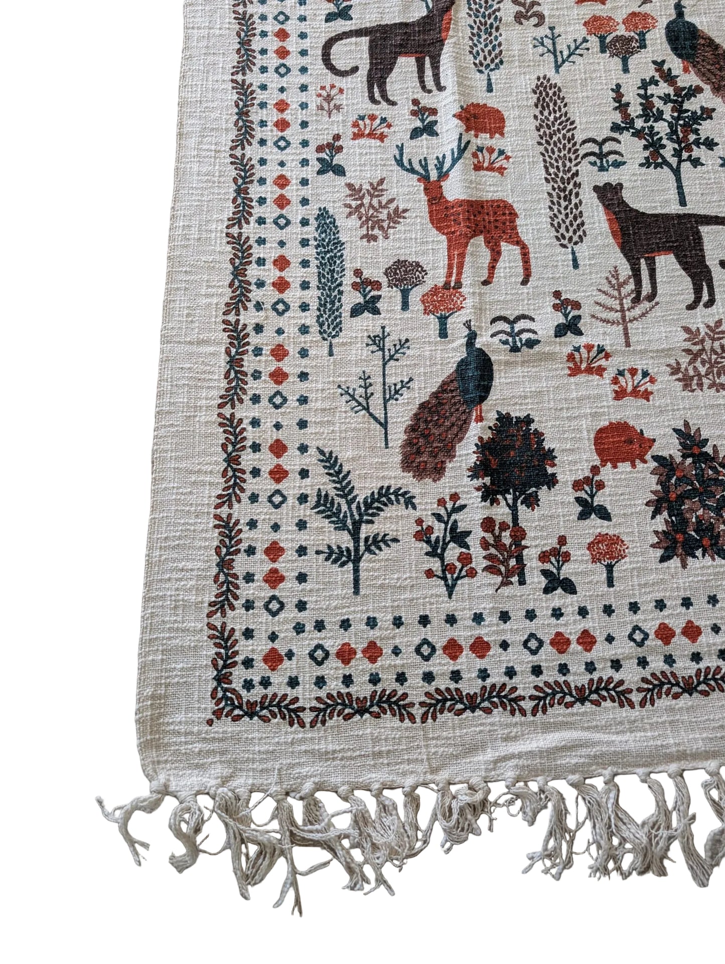 Textile with animal and nature patterns on a beige background