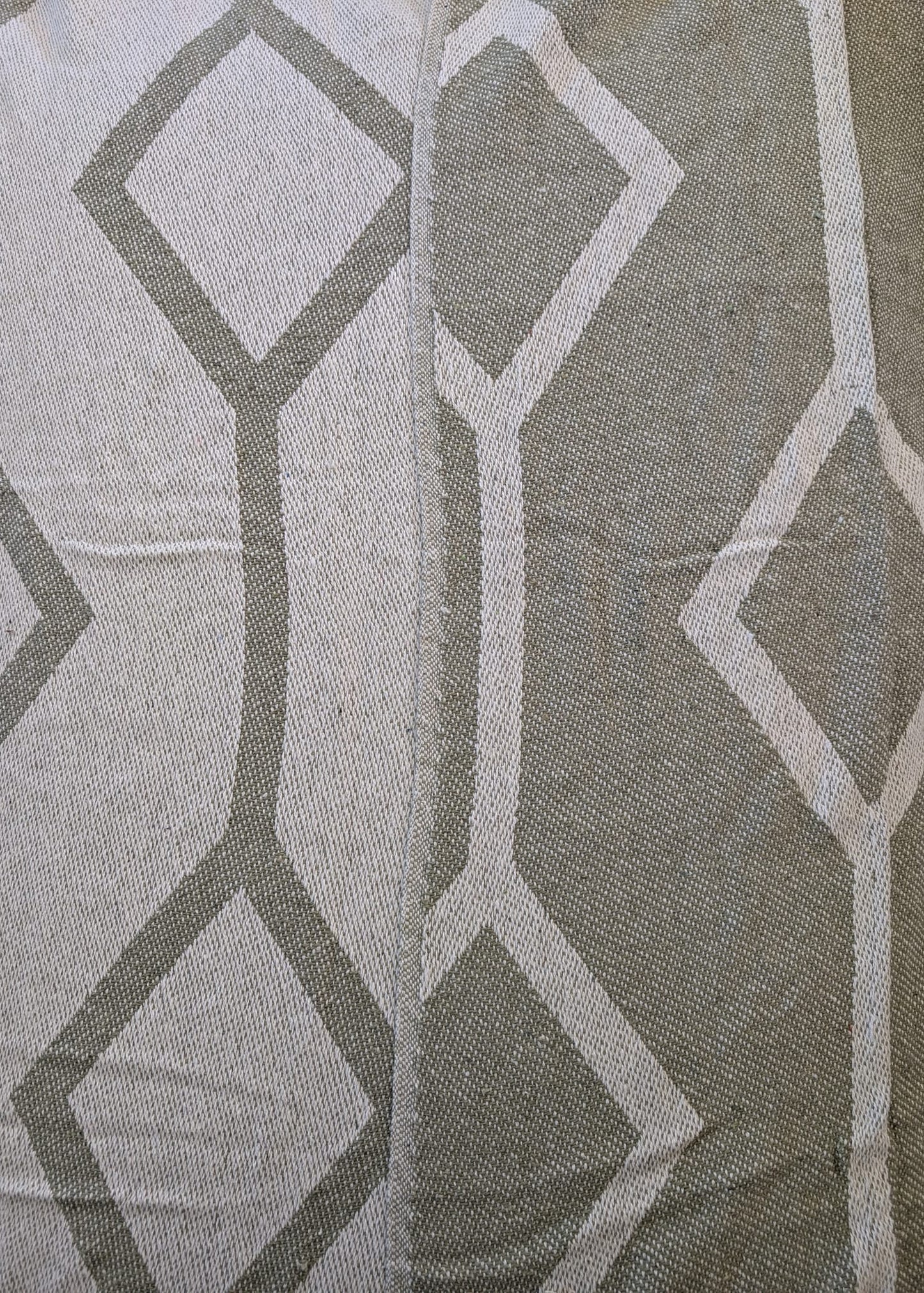 Close-up of fabric with geometric pattern in gray and white
