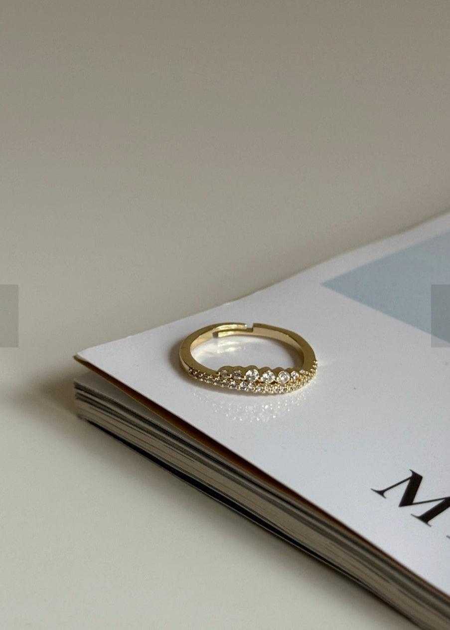 Gold ring on a magazine with a blurred background
