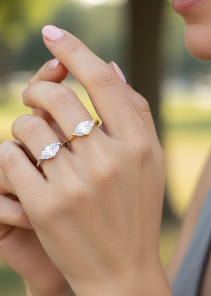 Close-up of a hand wearing two diamond rings with a blurred outdoor background